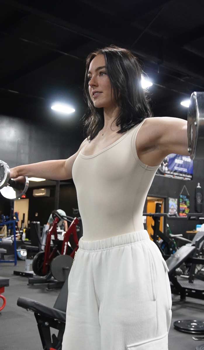 The coach is working out at the gym.